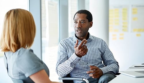 business-people-discussing-captive-insurance-solutions-714x410